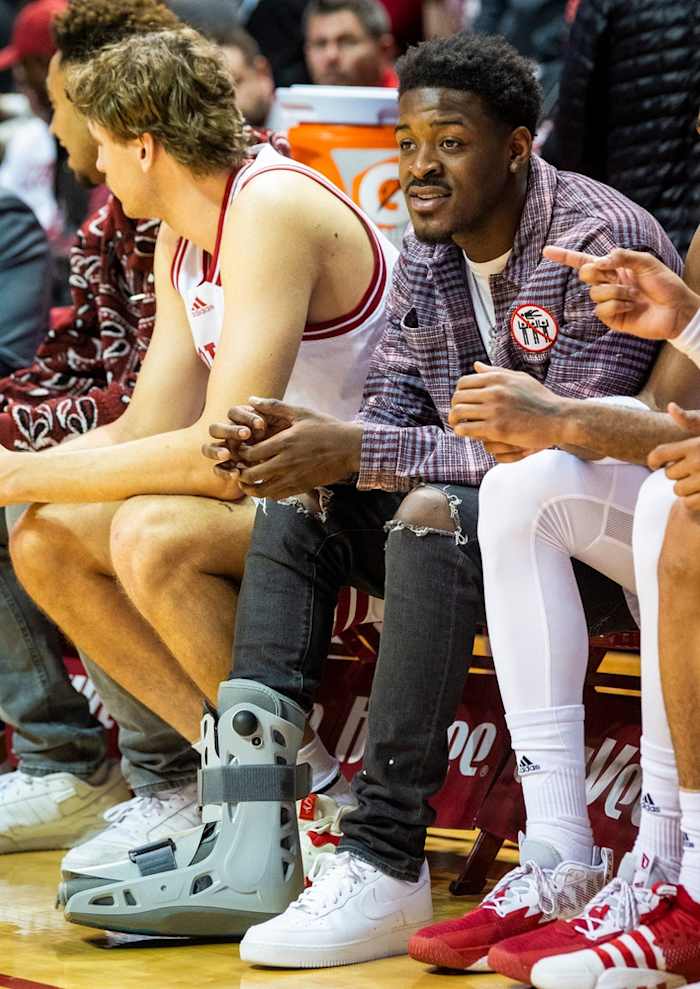 Indiana guard Xavier Johnson sits on the bench Tuesday with a boot on his right foot. He had surgery on Wednesday and will miss several weeks. (USA TODAY Sports)