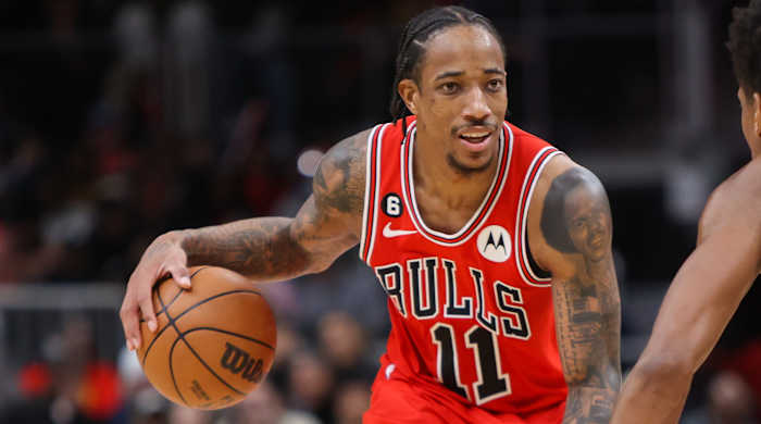 Bulls forward DeMar DeRozan (11) dribbles the ball during a game against the Hawks.