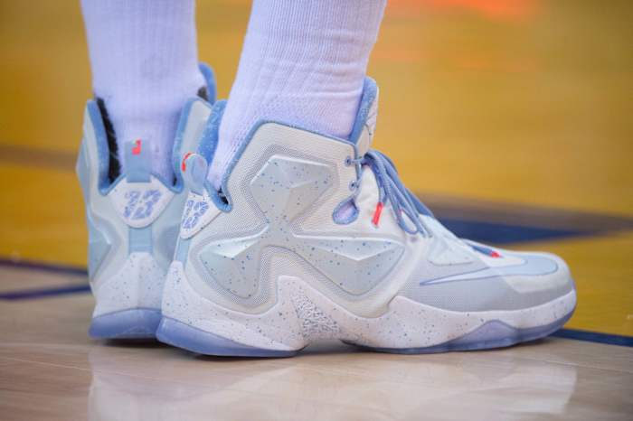 View of white and blue Nike LeBron shoes.