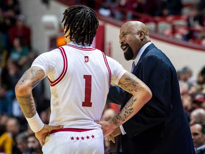 Indiana guard Jalen Hood-Schifino listens to coach Mike Woodson on the sidelines (USA TODAY Sports)