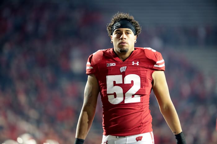 Wisconsin outside linebacker Kaden Johnson walking off the field at Camp Randall Stadium.