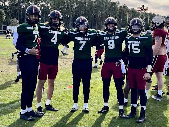 The quarterback group got together for a photo.