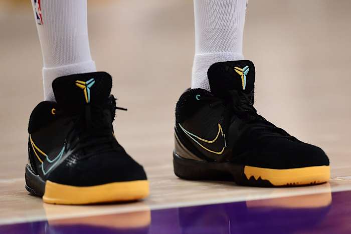 View of black and gold Nike Kobe shoes.