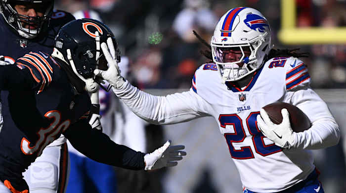 Buffalo Bills running back James Cook stiff arms Chicago Bears defensive back DeAndre Houston-Carson