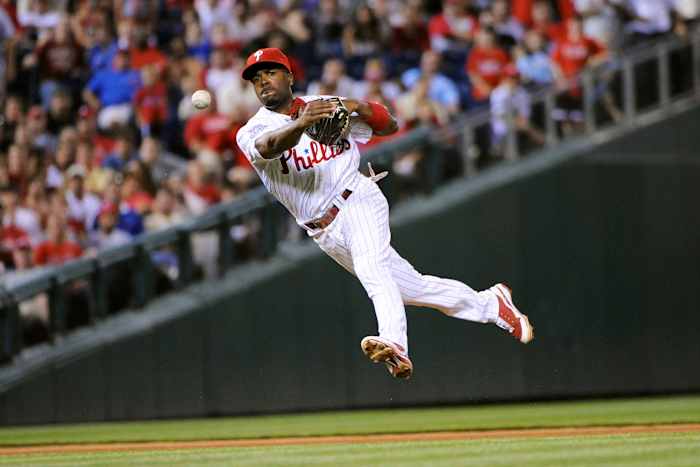 Phillies shortstop Jimmy Rollins throws to first base in the ninth inning against the Red Sox at Citizens Bank Park in a game on June 12, 2009.