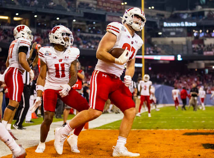 Wisconsin tight end Hayden Rucci celebrates a touchdown reception against Oklahoma State in the Guaranteed Rate Bowl.