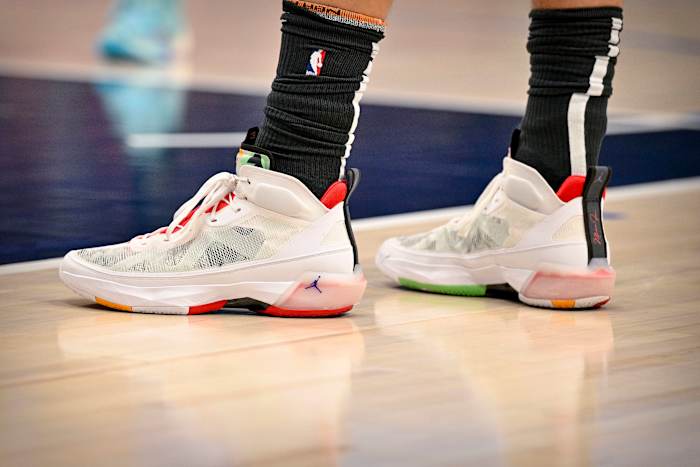 View of white and red Jordan shoes.