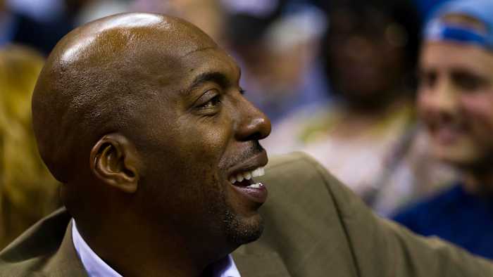John Salley watches a game between the Detroit Pistons and the Philadelphia 76ers in 2012
