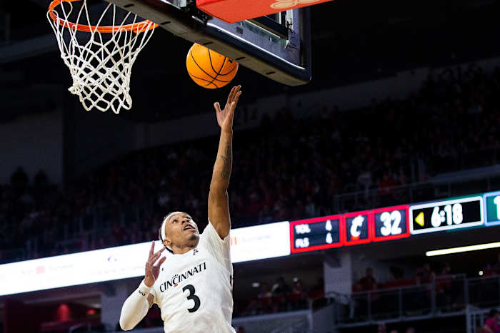 Cincinnati Bearcats guard Mika Adams-Woods (3) makes a layup during the first half of an NCAA men s college basketball game on Thursday, Dec. 29, 2022, at Fifth Third Arena in Cincinnati. The Bearcats defeated the Green Wave 88-77 with a crowd of 9,484. Tulane Green Wave At Cincinnati Bearcats Ncaa Basketball Dec 29