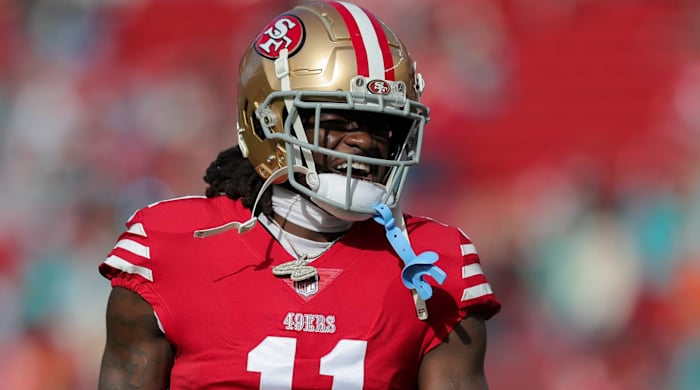 49ers wide receiver Brandon Aiyuk yells in between plays during a game.