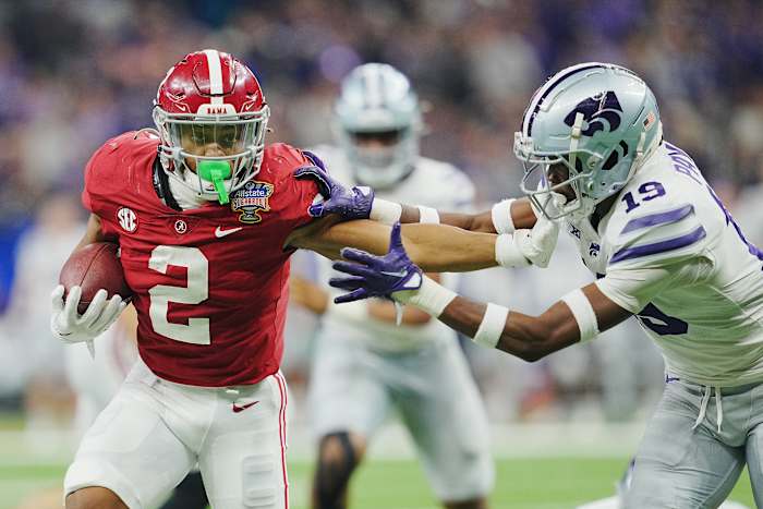 Alabama Crimson Tide running back Jase McClellan (2) runs the ball against Kansas State Wildcats Kansas State Wildcats safety VJ Payne (19) during the second half in the 2022 Sugar Bowl at Caesars Superdome.