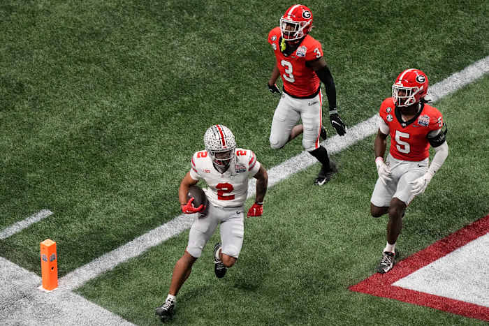Ohio State wide receiver Emeka Egbuka runs into the end zone for a touchdown against Georgia.