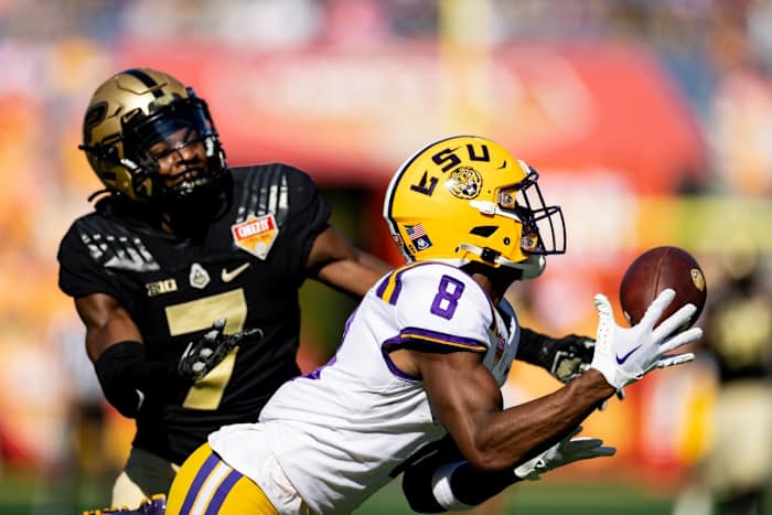 LSU Tigers wide receiver Malik Nabers (8) attempts to catch a pass over Purdue Boilermakers cornerback Jamari Brown (7) during the first half at Camping World Stadium.