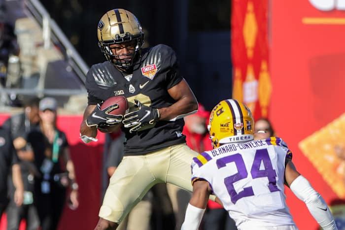 Purdue Boilermakers wide receiver TJ Sheffield (8) catches a pass in front of LSU Tigers cornerback Jarrick Bernard-Converse (24) during the second half at Camping World Stadium.
