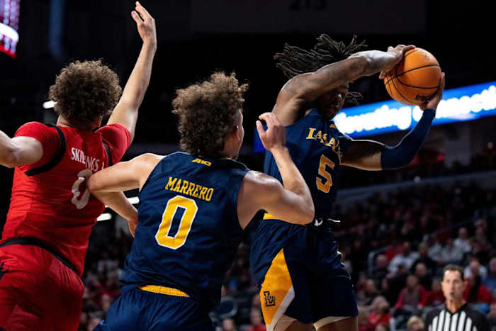 La Salle Explorers guard Khalil Brantley (5) grabs a rebound over Cincinnati Bearcats guard Daniel Skillings (0) in the first half of the NCAA men s basketball game at Fifth Third Arena in Cincinnati on Saturday, Dec. 17, 2022. Ncaa Basketball La Salle Explorers At Cincinnati Bearcats Ac