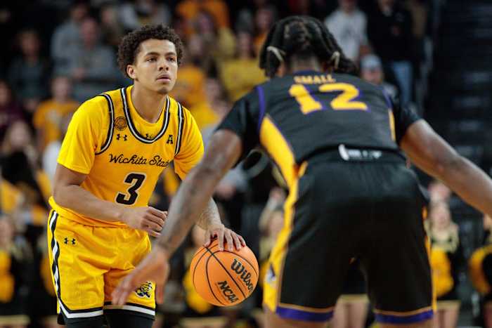 Dec 31, 2022; Wichita, Kansas, USA; Wichita State Shockers guard Craig Porter Jr. (3) looks to set the play around East Carolina Pirates guard Javon Small (12) during the second half at Charles Koch Arena. Mandatory Credit: William Purnell-USA TODAY Sports