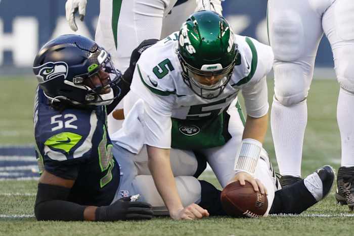 Defensive end Darrell Taylor (52) celebrates following a sack of New York Jets quarterback Mike White (5) during the fourth quarter at Lumen Field.