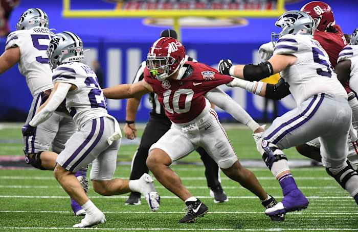 Kansas State running back Deuce Vaughn (22) runs the ball while Alabama linebacker Henry To'o To'o (10) closes to make a tackle during the 2022 Sugar Bowl at Caesars Superdome.