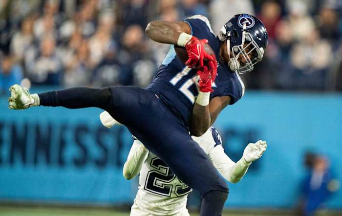 Tennessee Titans wide receiver Treylon Burks (16) pulls in a catch over Dallas Cowboys cornerback C.J. Goodwin (29) during the fourth quarter at Nissan Stadium Thursday, Dec. 29, 2022, in Nashville, Tenn.