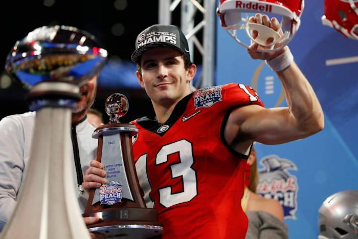 Georgia quarterback Stetson Bennett, Georgia Bulldogs football, MVP trophy, Peach Bowl, Ohio State, College Football Playoff