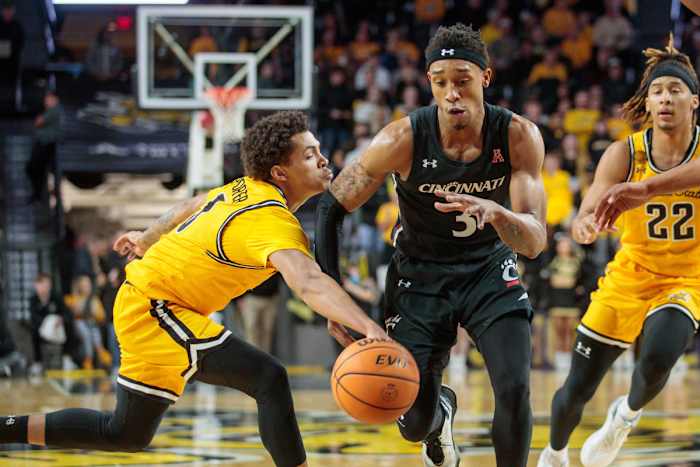 Jan 5, 2023; Wichita, Kansas, USA; Wichita State Shockers guard Craig Porter Jr. (3) steals the ball from Cincinnati Bearcats guard Mika Adams-Woods (3) during the first half at Charles Koch Arena. Mandatory Credit: William Purnell-USA TODAY Sports