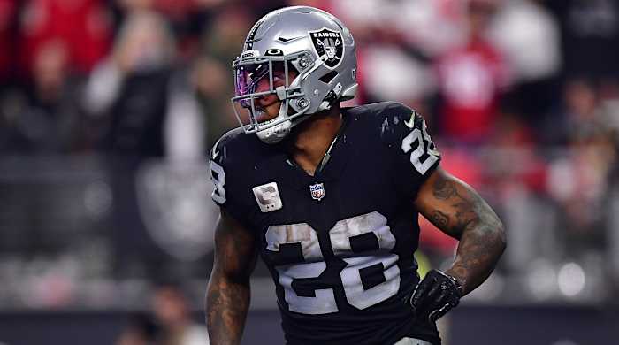 Raiders running back Josh Jacobs (28) scores a touchdown during a game against the 49ers.