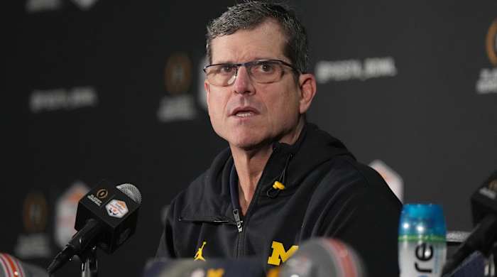 Michigan head coach Jim Harbaugh speaks with media after the Fiesta Bowl vs. TCU.