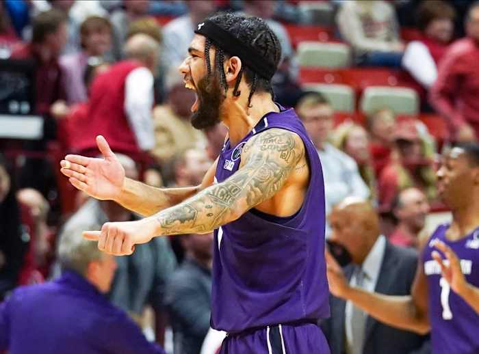 Northwestern Wildcats guard Boo Buie (0) celebrates after defeating the Indiana Hoosiers at Simon Skjodt Assembly Hall.