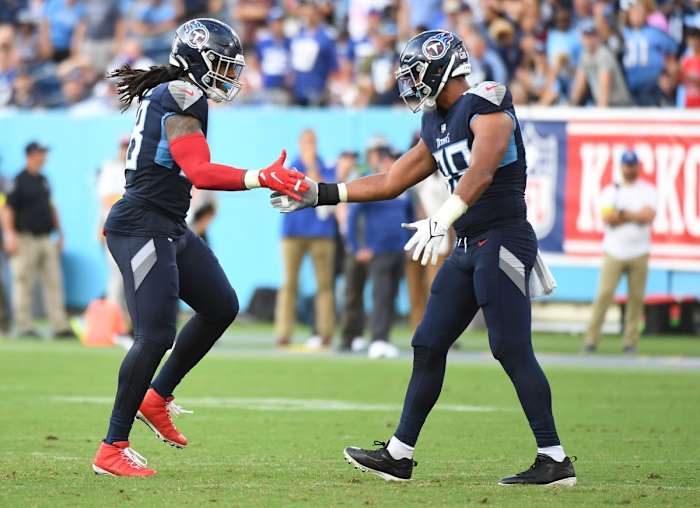 Tennessee Titans linebacker Bud Dupree (48) and linebacker Rashad Weaver (99) celebrate after a defensive stop during the second half against the New York Giants at Nissan Stadium.