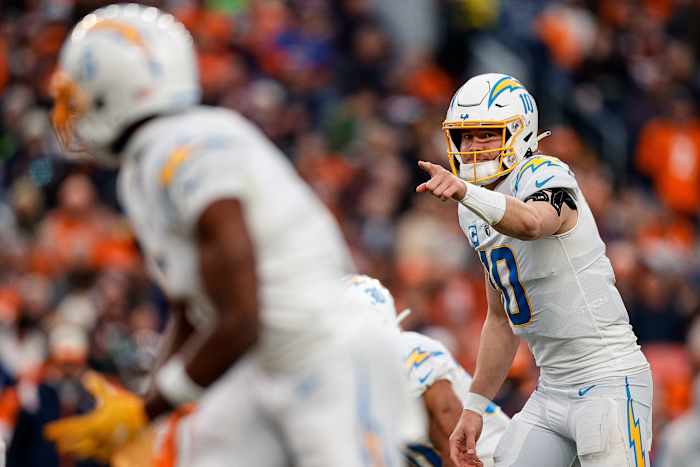 Jan 8, 2023; Denver, Colorado, USA; Los Angeles Chargers quarterback Justin Herbert (10) gestures at the line of scrimmage in the third quarter against the Denver Broncos at Empower Field at Mile High. Mandatory Credit: Isaiah J. Downing-USA TODAY Sports