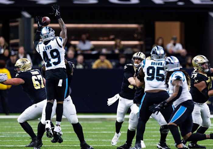 Carolina Panthers linebacker Frankie Luvu (49) blocks a pass from New Orleans Saints quarterback Andy Dalton (14). Mandatory Credit: Stephen Lew-USA TODAY