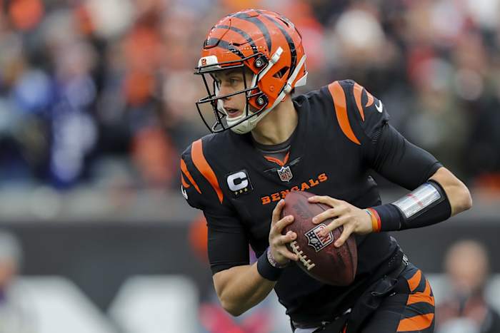 Jan 8, 2023; Cincinnati, Ohio, USA; Cincinnati Bengals quarterback Joe Burrow (9) runs with the ball against the Baltimore Ravens in the first half at Paycor Stadium. Mandatory Credit: Katie Stratman-USA TODAY Sports
