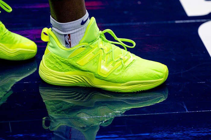 View of green New Balance shoes.