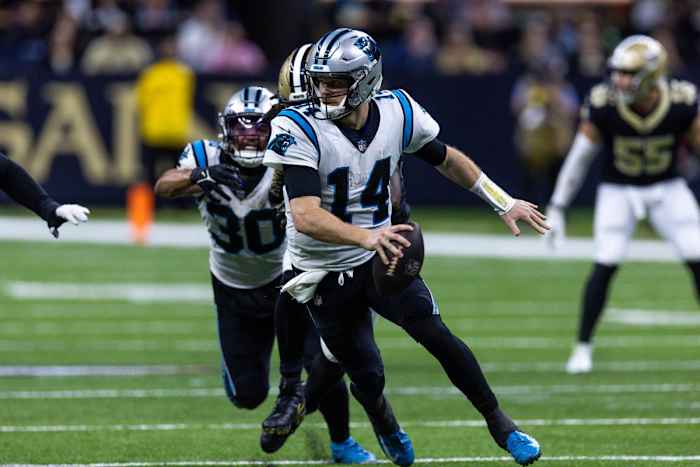 Jan 8, 2023; New Orleans, Louisiana, USA; Carolina Panthers quarterback Sam Darnold (14) scrambles out the pocket against the New Orleans Saints during the second half at Caesars Superdome.