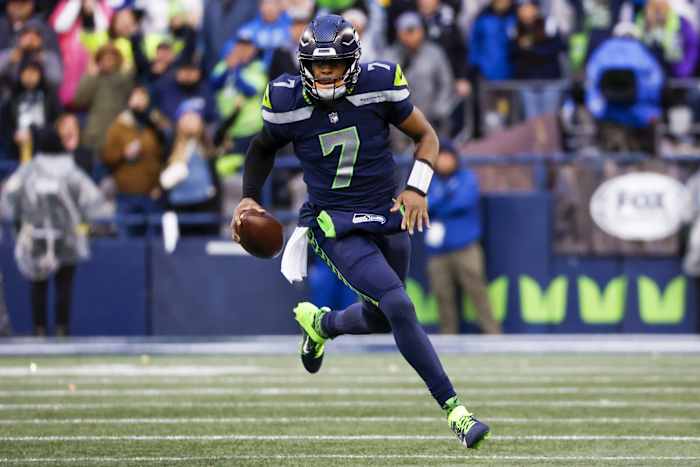 Jan 8, 2023; Seattle, Washington, USA; Seattle Seahawks quarterback Geno Smith (7) scrambles against the Los Angeles Rams during the fourth quarter at Lumen Field.
