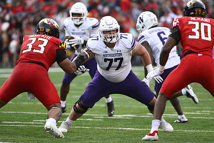 Northwestern Wildcats offensive lineman Peter Skoronski (77) prepares to block against the Maryland Terrapins at SECU Stadium.