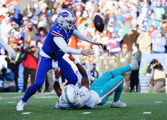 Bills quarterback Josh Allen tossed a pair of interceptions and fumbled against the Dolphins in their wild-card playoff game.