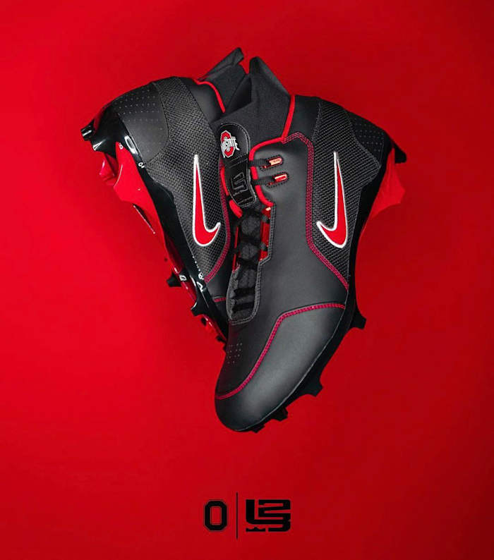 View of black and red Nike cleats.