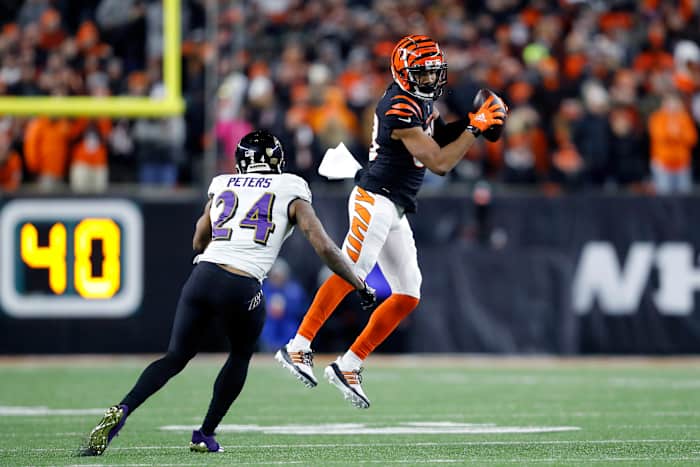 Jan 15, 2023; Cincinnati, Ohio, USA; Cincinnati Bengals wide receiver Tyler Boyd (83) makes a catch while defended by Baltimore Ravens cornerback Marcus Peters (24) during the second half in a wild card game at Paycor Stadium. Mandatory Credit: Joseph Maiorana-USA TODAY Sports