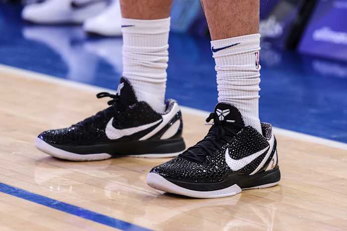 View of black and white Nike Kobe shoes.