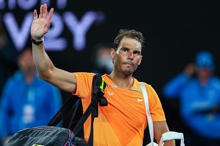 Rafael Nadal waves to fans after being upset at the 2023 Australian Open.