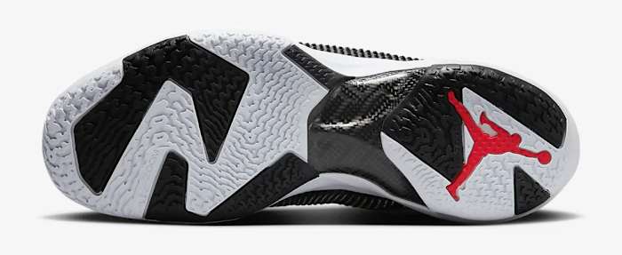 View of white, lack, and red Air Jordan shoe.