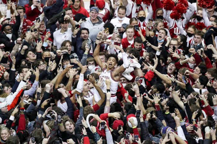 Indiana guard Rob Phinisee celebrates with fans on the court after the Hoosiers' 68-65 win over Purdue on Jan. 20, 2022 at Simon Skjodt Assembly Hall in Bloomington, Ind.