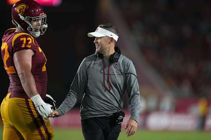 Los Angeles, California, USA; Southern California Trojans head coach Lincoln Riley and offensive lineman Andrew Vorhees (72) react in the second half against the Fresno State Bulldogs at United Airlines Field at Los Angeles Memorial Coliseum.