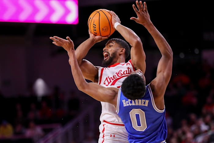 Jan 22, 2023; Cincinnati, Ohio, USA; Cincinnati Bearcats guard David DeJulius (5) plays the court against Memphis Tigers guard Elijah McCadden (0) in the first half at Fifth Third Arena. Mandatory Credit: Katie Stratman-USA TODAY Sports