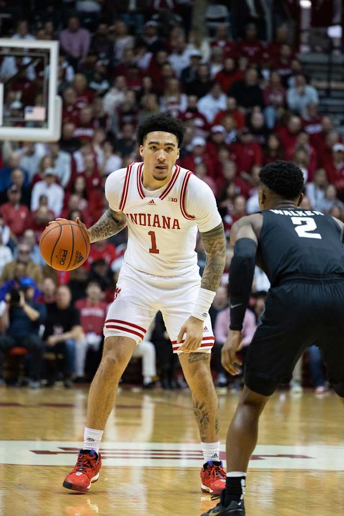 Indiana Hoosiers guard Jalen Hood-Schifino (1) dribbles the ball while Michigan State Spartans guard Tyson Walker (2) sets up defense.