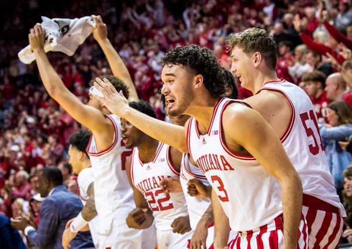 Indiana's Anthony Leal (3) and the bench celebrate a Miller Kopp (12) dunk during the second half of the Indiana versus Michigan State.