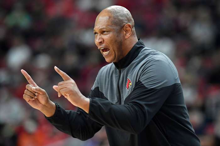 Kenny Payne yells out a play to his Louisville players.
