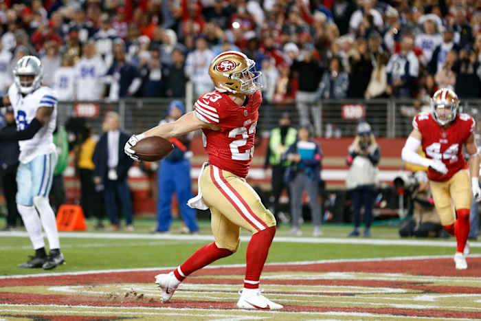 ANTA CLARA, CALIFORNIA - JANUARY 22: Christian McCaffrey #23 of the San Francisco 49ers celebrates after rushing for a touchdown against the Dallas Cowboys during the fourth quarter in the NFC Divisional Playoff game at Levi's Stadium on January 22, 2023 in Santa Clara, California.