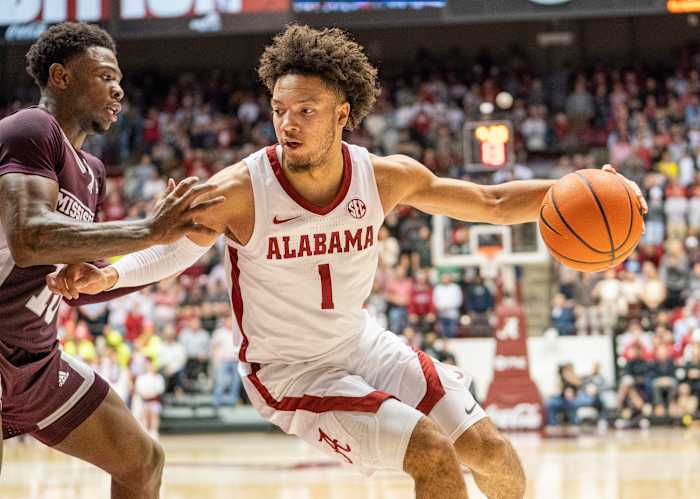Alabama Crimson Tide guard Mark Sears (1) drives to the basket against Mississippi State Bulldogs guard Dashawn Davis (10) during the second half at Coleman Coliseum.